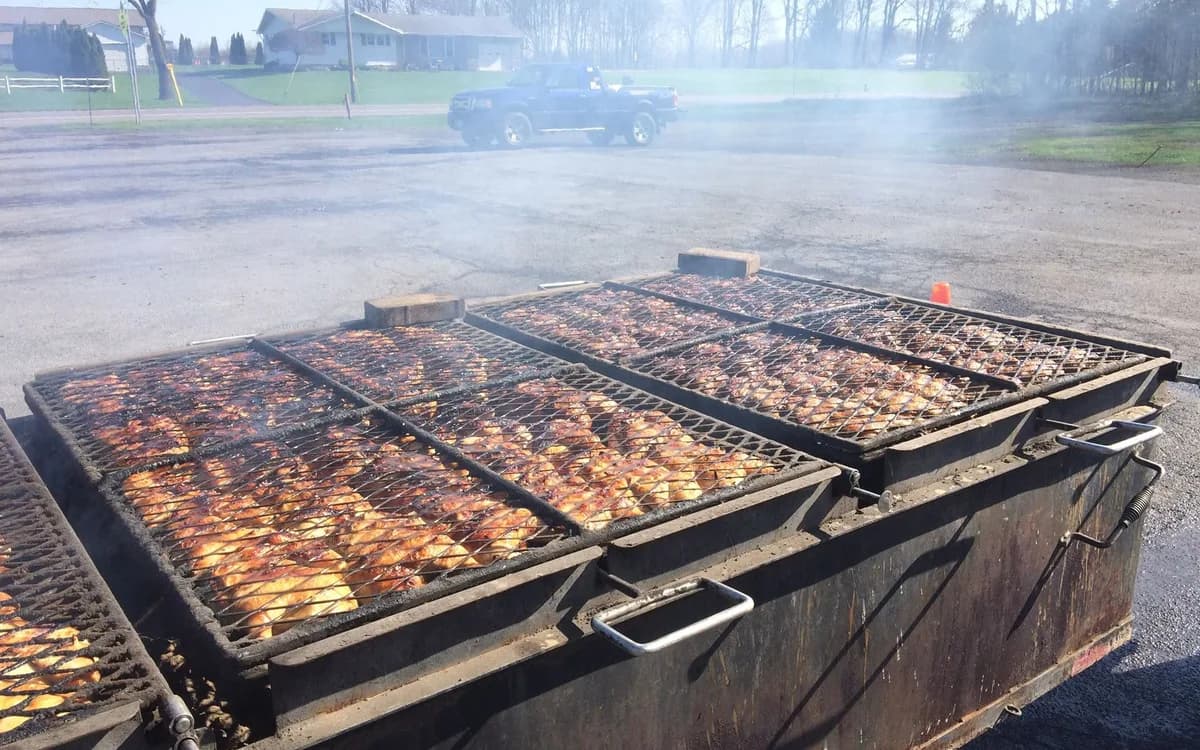 Barbecue cooking over Bomber's large outdoor grill